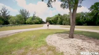 A hot woman is having fun with a guy in the park