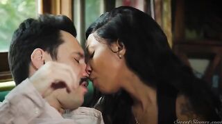 A woman is having sex with a guy who looks like a hitman