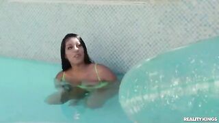 A hot girl teaches her friend to swim in the pool, passing on great lessons