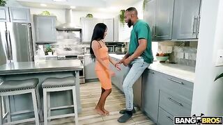A man with a huge cock fucks a young girl in the kitchen