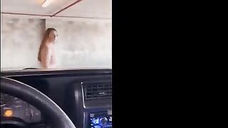 A hot girl is fucking in the public garage with strangers around