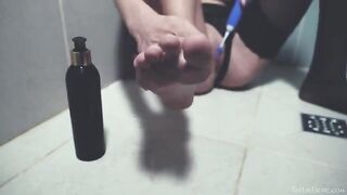 In the shower, beauty plays with her favorite toy