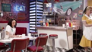 A girl is working as a waitress in an unusual way