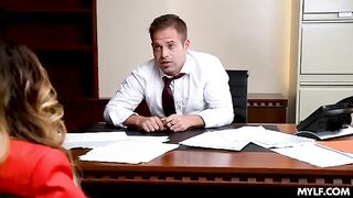 A busty milf is having fun with her colleague in the office