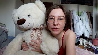 A cute young girl has a teddy bear as her best friend