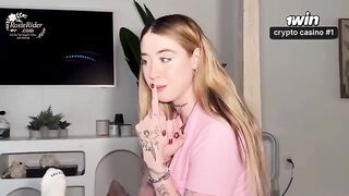 A girl with appetizing forms wears a white sweat suit. It’s very sexy