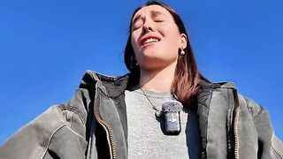 A petite brunette babe masturbating on the public beach