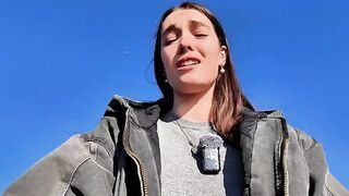 A petite brunette babe masturbating on the public beach